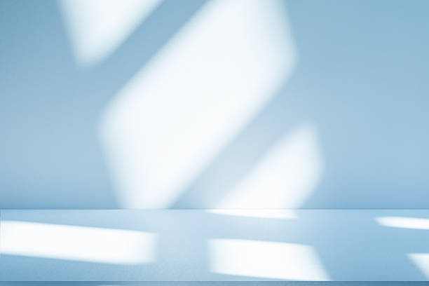 istock Studio style background wall decoration presentation uses white and blue tones. with shadows cast from a nearby window, concept creating a decorative 2210498443