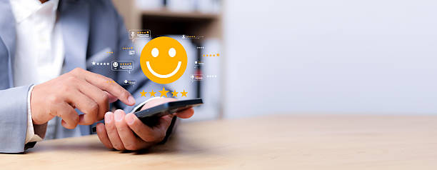 istock Online customer satisfaction Survey service concept. Satisfaction survey, customers use smartphones to rate their experience with five stars. 2210505730