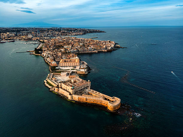 istock Historical Syracuse Center on Sicilian Coastline at Sunset 2210505744
