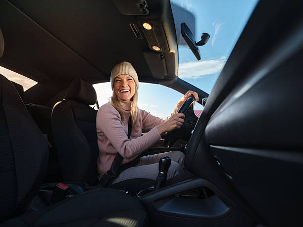 istock Happy woman going on a trip by car. 2210506259