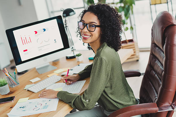 istock Confident Businesswoman Working in Modern Office Setting with Professional Presentation 2210507803