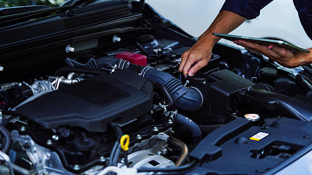 istock Auto mechanic hands using wrench to repair auto engine. Car maintenance, service at garage. Technician inspects vehicle for problems. Auto repair, fixing, check, services, insurance, checkup concept. 2210508862