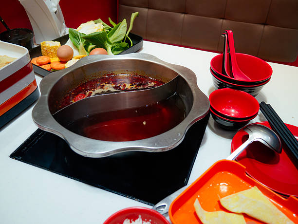istock Sichuan mala hotpot (mala huoguo) set on restaurant table. 2210510141