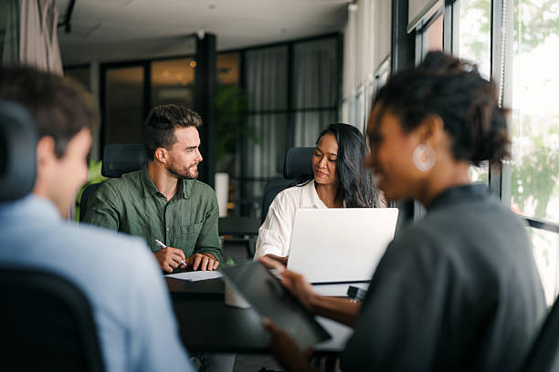 istock A diverse, talented team collaborates effectively in a bright office space during a business meeting 2210510650