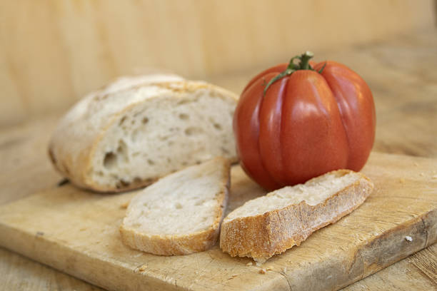 sliced bread with ripe fresh tomato from the garden