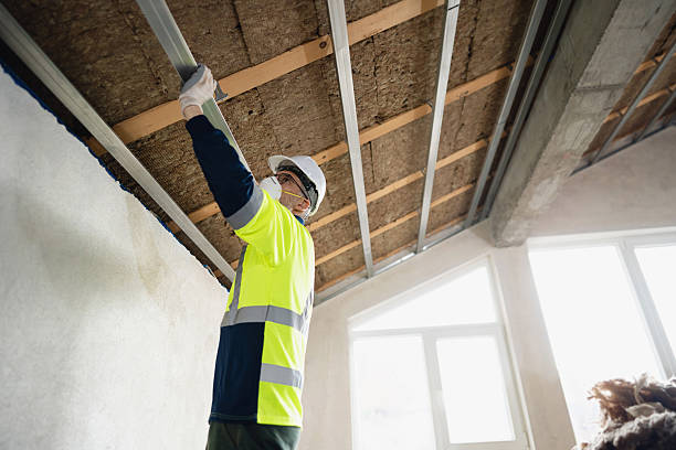 istock Worker Installing Ceiling Aluminum Profile and Insulation Panels and Frame in a Residential Attic Ceiling 2210517228