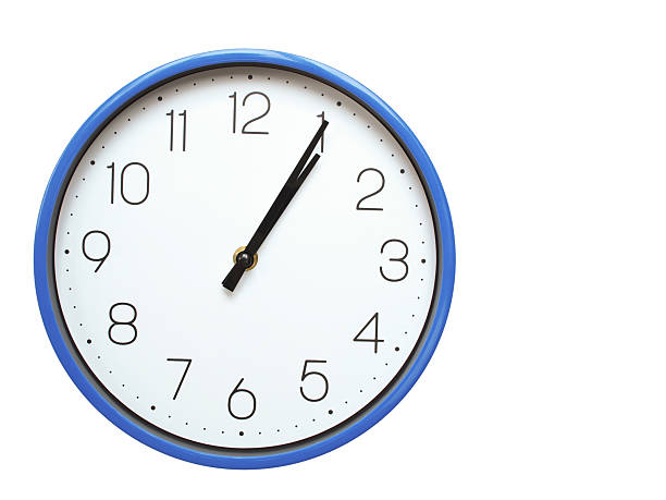 Wall clock with blue frame showing 1.05 01.05 or 13.05 O clock  on white background, suitable for time related articles, education, or punctuality concepts