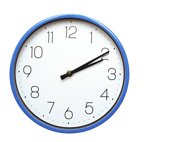 Wall clock with blue frame showing 2.10 02.10 or 14.10 O clock  on white background, suitable for time related articles, education, or punctuality concepts