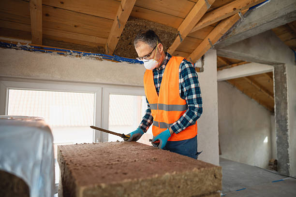 istock Worker preparing insulation materials in the attic of a house 2210517401