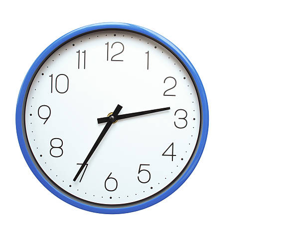 Wall clock with blue frame showing 2.35 02.35 or 14.35 O clock  on white background, suitable for time related articles, education, or punctuality concepts