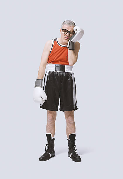 istock Desperate boxer touching his painful face after getting punched 2210517638