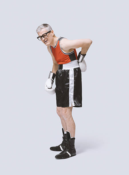 istock Sad desperate boxer with back pain 2210517665