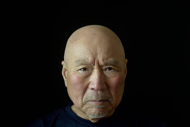 Close-up of an elderly man's troubled face