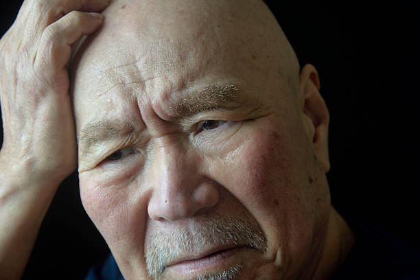 istock Close-up of an elderly man's troubled face 2210517732