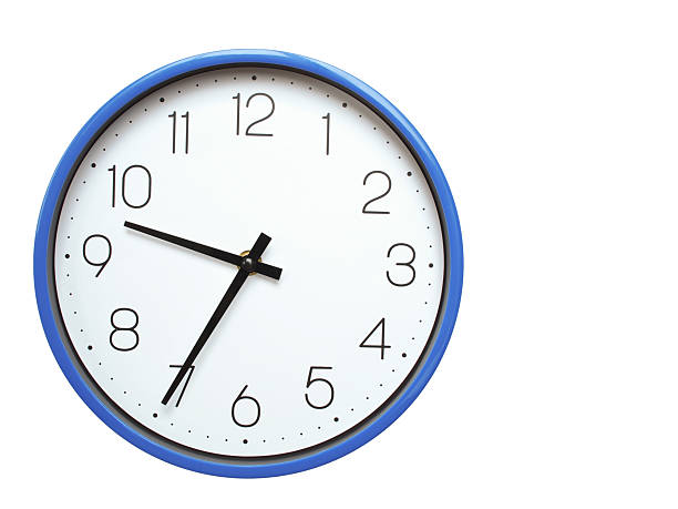 istock Wall clock with blue frame showing 9.35 09.35 or 21.35 O clock  on white background, suitable for time related articles, education, or punctuality concepts 2210517778