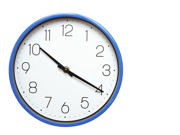 istock Wall clock with blue frame showing 10.20 10.20 or 22.20 O clock  on white background, suitable for time related articles, education, or punctuality concepts 2210517806