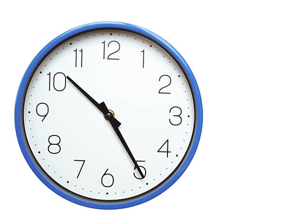 istock Wall clock with blue frame showing 10.25 10.25 or 22.25 O clock  on white background, suitable for time related articles, education, or punctuality concepts 2210517812