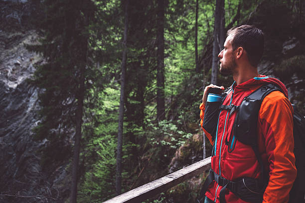 istock Man Contemplating in a Lush Forest 2210517944