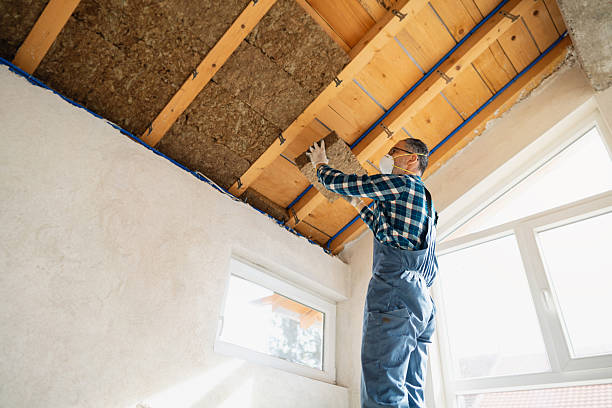 istock Worker installing insulation panels under the roof with mineral wool in attic 2210518078