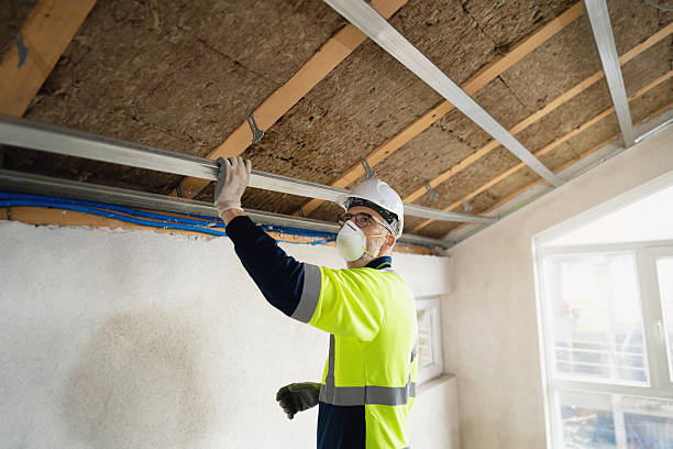 istock Construction worker installing ceiling insulation with metal profiles in an attic 2210518278