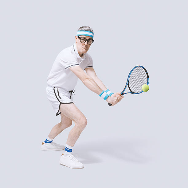 istock Funny tennis player hitting the ball 2210518554