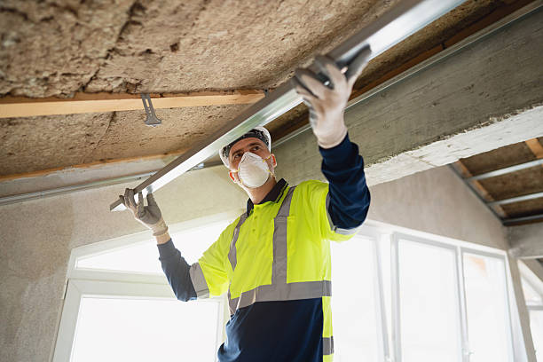 istock Construction worker installing insulation and aluminum profile in attic ceiling renovation 2210518960