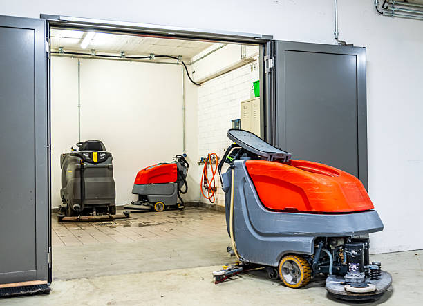 istock Industrial cleaning equipment in a storage area with multiple machines ready for use in a facility 2210519384