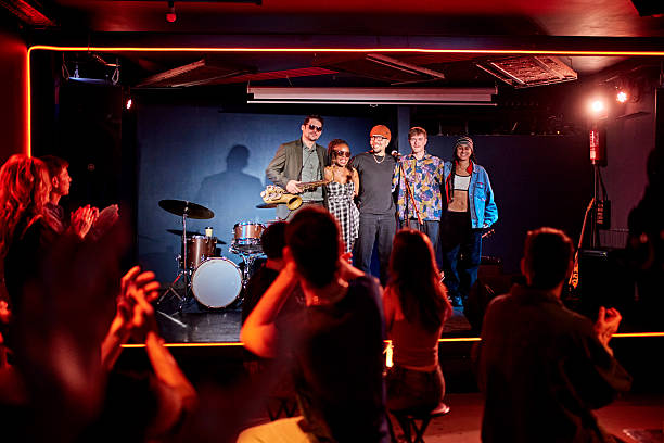 istock Smiling jazz band accepting applause for their performance 2210519763