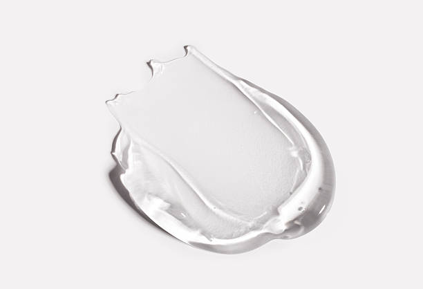 istock smears cream gel texture on gray background 2210520295