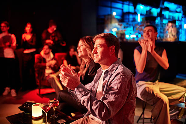 istock Nightclub audience applauding onstage entertainment 2210520547