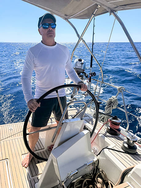 istock Skipper sailing on sailboat 2210520550