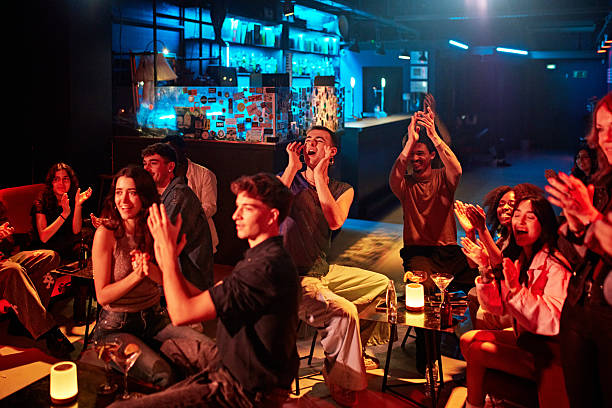 istock Enthusiastic audience applauding nightclub performance 2210521014