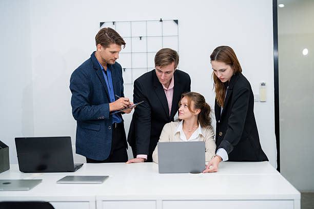 istock Team collaborates to discuss project details in modern office setting during daytime hours 2210522081