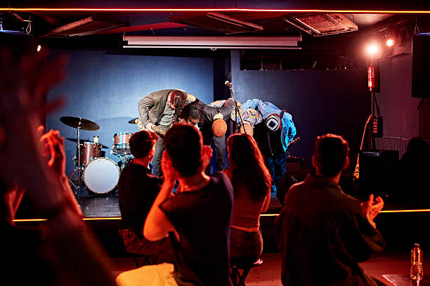 Jazz band bowing to appreciative nightclub audience