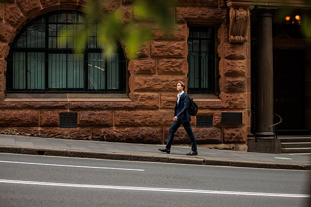 istock Young Professional with Backpack Walking in Sydney 2210522571