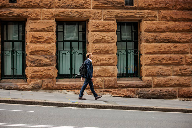 istock Young Businessman with Backpack Walking in Sydney 2210522802