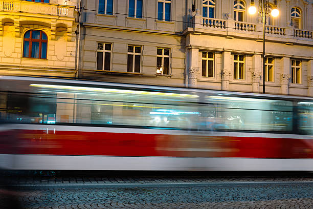 Tram Trails Illuminate A Night Prague Street, Fast Moving City Electric Transport