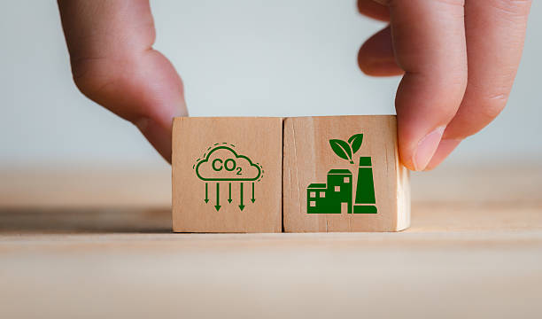 istock Wooden Blocks Symbolizing Carbon Emission Reduction and Sustainability 2210524131
