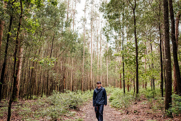 istock Man walking in a park during a cloudy day 2210527118
