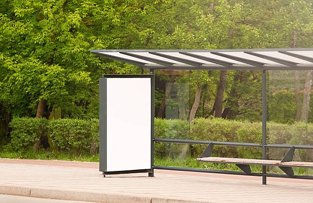 istock Bus stop with lightbox. Empty white billboard advertising panel at bus stop. Background for mockup 2210528957