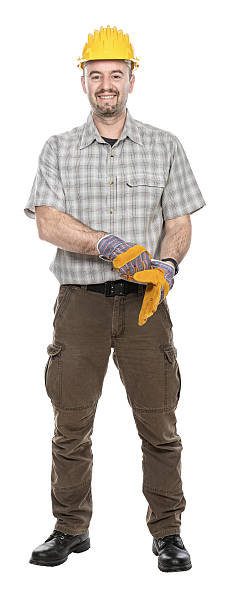 istock Smiling construction worker putting on work gloves getting ready for job 2210529106
