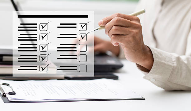 istock Business performance checklist and businessman review document and check mark 2210531464