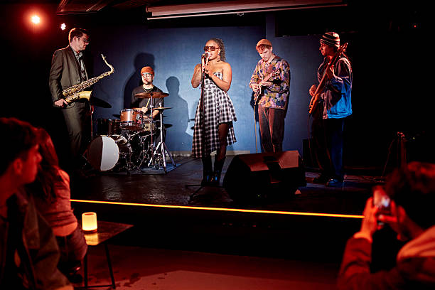 istock Chanteuse and band performing at nightclub 2210537219