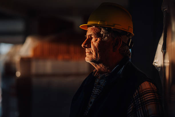 istock Senior construction worker wearing hard hat inspecting warehouse 2210539266