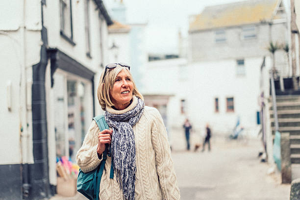 Woman exploring St Ives, a famous town on the north coast of Cornwall, England.