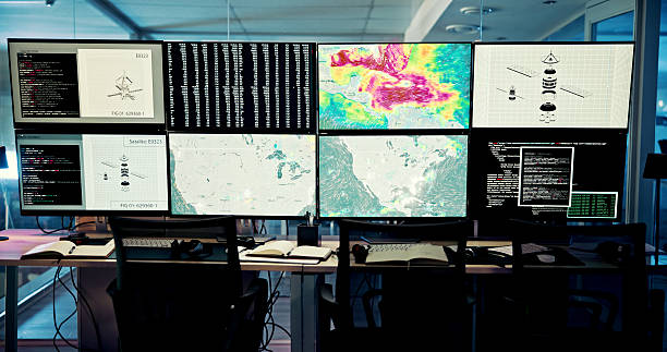 istock Screen, weather and computer for wind forecast for news, research or ecology in office. Night, empty or tracking technology equipment with maps for meteorology report, radar update for climate change 2210543160