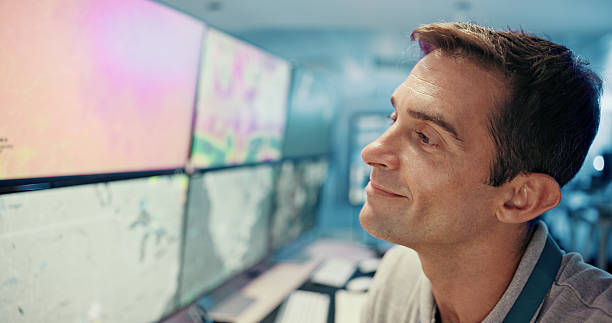 istock Control room, thinking and man in office, computer screen and tech for meteorology, decision or solution. Person, climate change or employee in workplace, pc or website info with results for research 2210543489