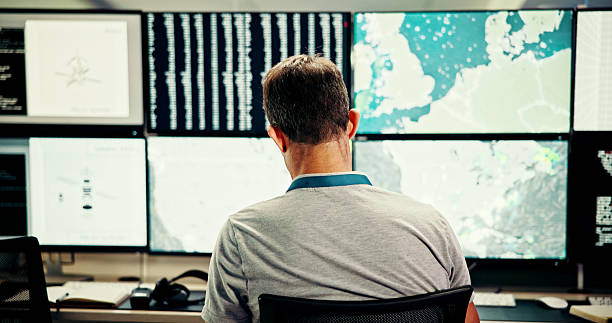 istock Screen, back or man on computer for maps for news, research or ecology in data center. Writing, check or monitor for tracking technology for meteorology report, storm radar or climate change forecast 2210543596