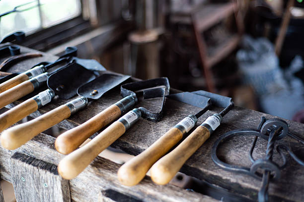 istock Vintage garden hand tool kit selection with price tag for sale at traditional trade workshop in Mansfield, Missouri, trowel, transplanter, cultivator, weeder with carbon steel head, wooden handle 2210543607
