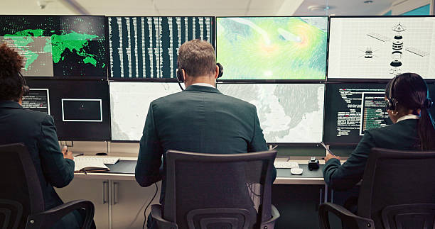 istock Data center, back or people with screen for maps, research or ecology in control room. Teamwork, satellite or computer for tracking technology for meteorology report, radar or climate change forecast 2210543674
